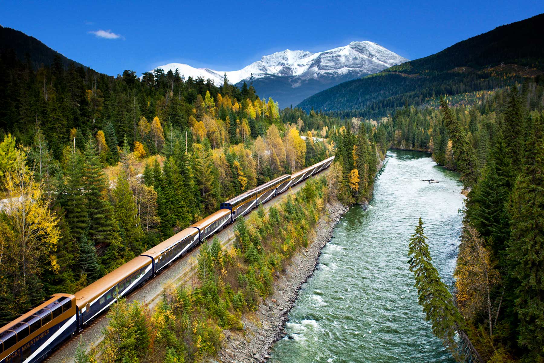 Luxury train moving through the Canadian Rocky Mountains
